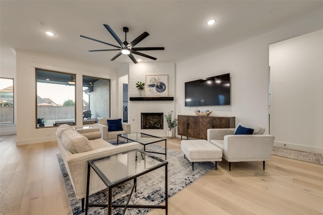 12104 Fairway Meadows Dr, Fort Worth, TX 76179 - living area featuring a ceiling fan, wood finished floors, a fireplace, recessed lighting, and ornamental molding