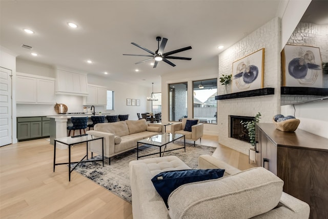 12104 Fairway Meadows Dr, Fort Worth, TX 76179 - living room with light wood-style floors, a brick fireplace, ceiling fan, and recessed lighting
