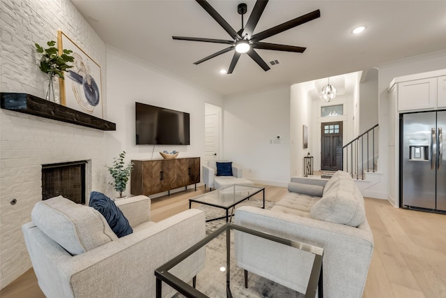 12104 Fairway Meadows Dr, Fort Worth, TX 76179 - living room with ceiling fan, light wood-type flooring, stairs, a fireplace, and recessed lighting
