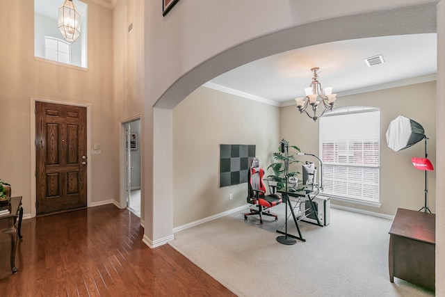 4757 Van Zandt Dr, Fort Worth, TX 76244 - exercise room with a chandelier, arched walkways, healthy amount of natural light, and crown molding
