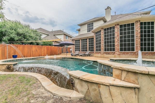 4757 Van Zandt Dr, Fort Worth, TX 76244 - view of swimming pool with a pool with connected hot tub and a patio area