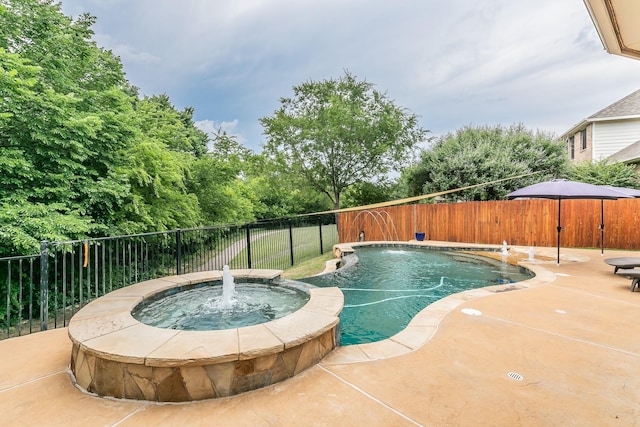 4757 Van Zandt Dr, Fort Worth, TX 76244 - view of swimming pool featuring a pool with connected hot tub, a fenced backyard, and a patio