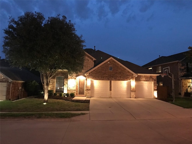 4757 Van Zandt Dr, Fort Worth, TX 76244 - view of front facade with concrete driveway, stone siding, a garage, and a yard