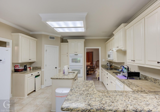 5345 Vermilion Pl, Keithville, LA 71047 - kitchen featuring white appliances, crown molding, light tile patterned floors, light stone countertops, and a peninsula
