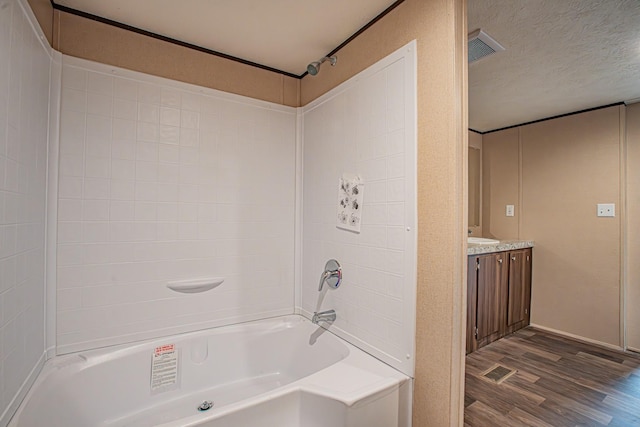 1613 Mockingbird Ln, Pelican Bay, TX 76020 - bathroom featuring wood finished floors, vanity, and shower / tub combination