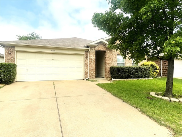 8309 Horse Whisper Ln, Fort Worth, TX 76131 - view of front of house with driveway, brick siding, an attached garage, and a front lawn