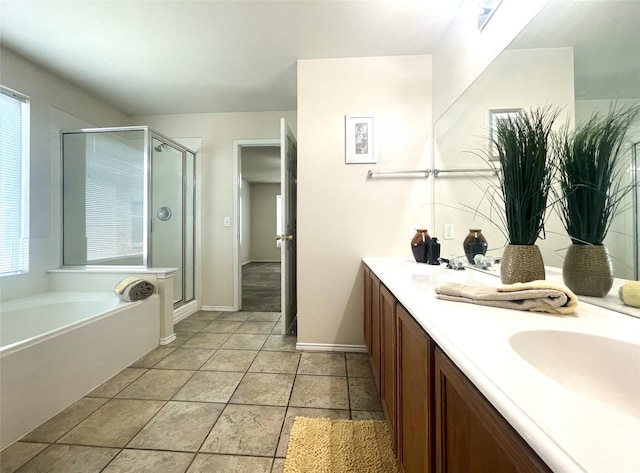 8309 Horse Whisper Ln, Fort Worth, TX 76131 - bathroom with a stall shower, a garden tub, double vanity, and baseboards