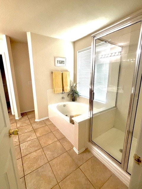 8309 Horse Whisper Ln, Fort Worth, TX 76131 - bathroom featuring a garden tub, a shower stall, and tile patterned floors