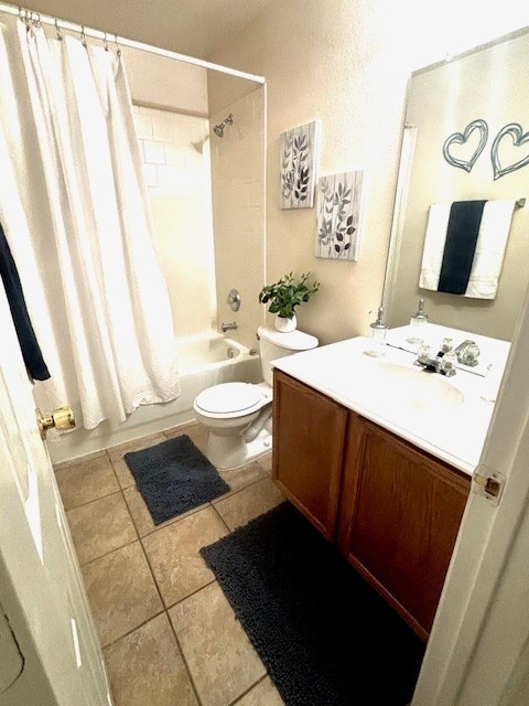 8309 Horse Whisper Ln, Fort Worth, TX 76131 - full bathroom with shower / bath combo with shower curtain, vanity, toilet, and tile patterned flooring