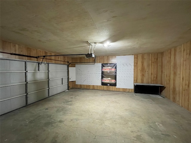 21992 Fm 226, Etoile, TX 75944 - garage with wooden walls and a garage door opener