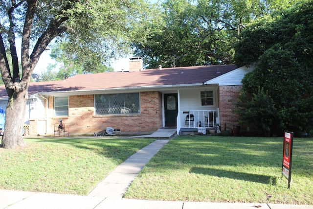 612 Ranier Cir, Garland, TX 75041 - view of front of house with brick siding, covered porch, a front lawn, a chimney, and a shingled roof