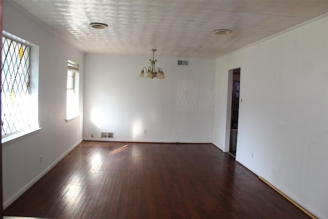 612 Ranier Cir, Garland, TX 75041 - empty room with a chandelier, wood finished floors, baseboards, and ornamental molding