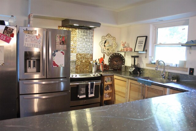 612 Ranier Cir, Garland, TX 75041 - kitchen with appliances with stainless steel finishes, under cabinet range hood, a sink, and dark stone counters