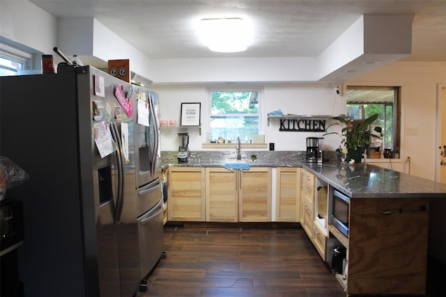 612 Ranier Cir, Garland, TX 75041 - kitchen with appliances with stainless steel finishes, a peninsula, dark wood-type flooring, light brown cabinetry, and dark stone counters