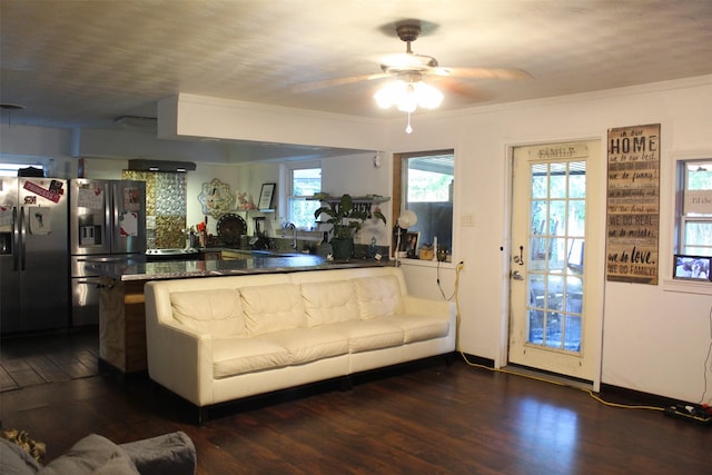 612 Ranier Cir, Garland, TX 75041 - living area featuring a ceiling fan and dark wood-type flooring