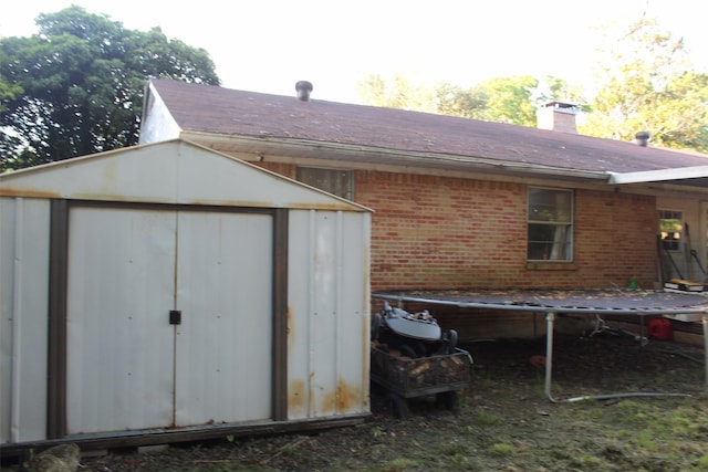 612 Ranier Cir, Garland, TX 75041 - view of shed featuring a trampoline