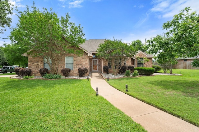 1601 Browning Ln, Cleburne, TX 76033 - view of front of home with brick siding and a front lawn