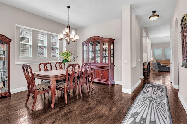 2305 Kemerton, Plano, TX 75025 - dining area with dark wood-type flooring, a chandelier, and baseboards