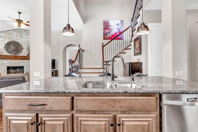 2305 Kemerton, Plano, TX 75025 - kitchen with a sink, a ceiling fan, stainless steel dishwasher, and arched walkways