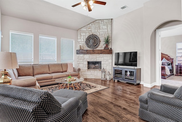 2305 Kemerton, Plano, TX 75025 - living room with lofted ceiling, ceiling fan, wood finished floors, arched walkways, and a fireplace