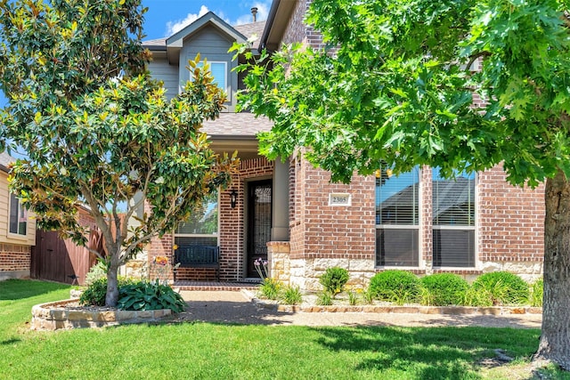 2305 Kemerton, Plano, TX 75025 - view of front of property featuring brick siding and a front lawn