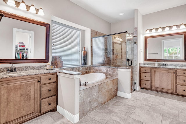 2305 Kemerton, Plano, TX 75025 - bathroom featuring a stall shower, a bath, two vanities, and a spacious closet