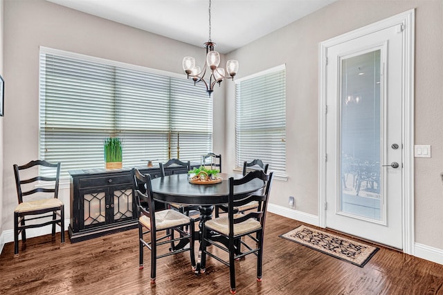 2305 Kemerton, Plano, TX 75025 - dining area with a chandelier, wood finished floors, and baseboards