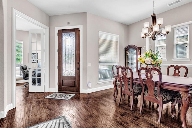 2305 Kemerton, Plano, TX 75025 - dining room with a chandelier, wood finished floors, and baseboards