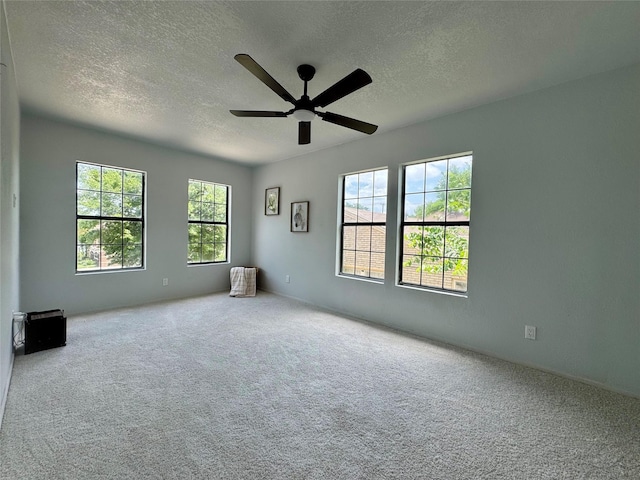 3107 Hale Ave, Fort Worth, TX 76106 - spare room with a textured ceiling, a ceiling fan, and carpet flooring