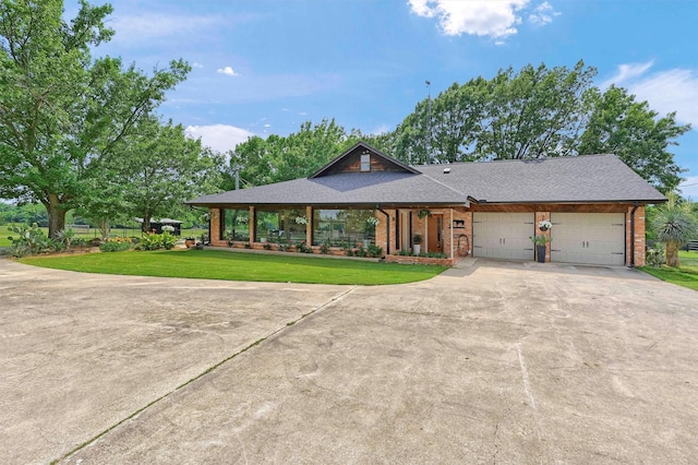 4034 Fm 2645, Savoy, TX 75479 - view of front of property featuring a garage, concrete driveway, brick siding, and a front lawn