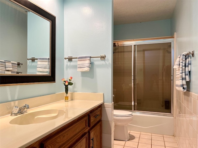 1604 Meadowgate Dr, Richardson, TX 75081 - bathroom with vanity, toilet, tile patterned flooring, and enclosed tub / shower combo
