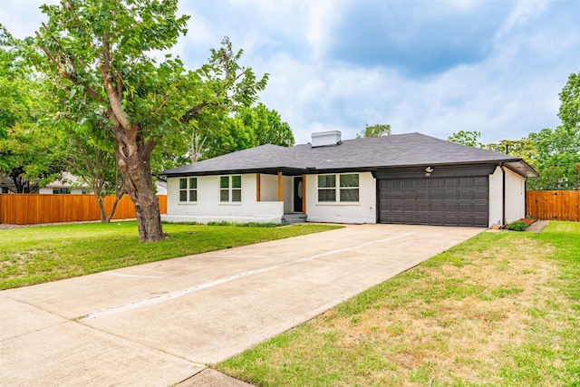214 Betty Dr, Richardson, TX 75081 - view of front of house featuring an attached garage, concrete driveway, brick siding, and a shingled roof
