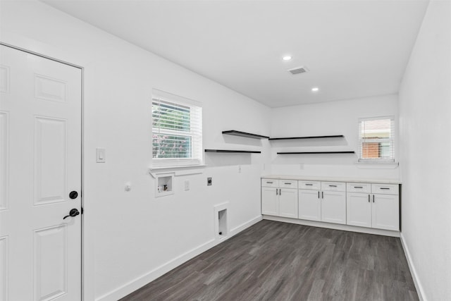 214 Betty Dr, Richardson, TX 75081 - laundry area featuring hookup for an electric dryer, gas dryer hookup, cabinet space, hookup for a washing machine, and dark wood-type flooring