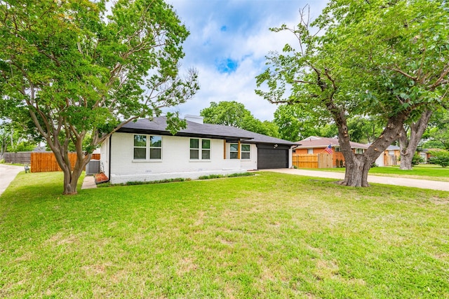 214 Betty Dr, Richardson, TX 75081 - view of front of property with concrete driveway, brick siding, and a garage