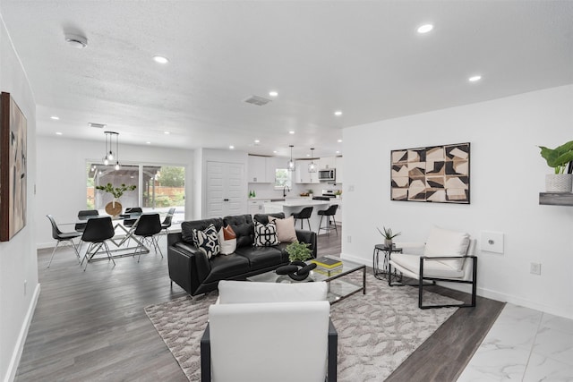 214 Betty Dr, Richardson, TX 75081 - living room with recessed lighting and baseboards