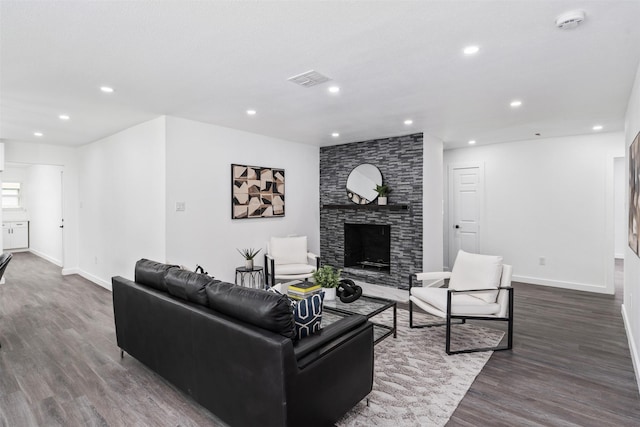 214 Betty Dr, Richardson, TX 75081 - living room featuring baseboards, recessed lighting, dark wood finished floors, and a stone fireplace