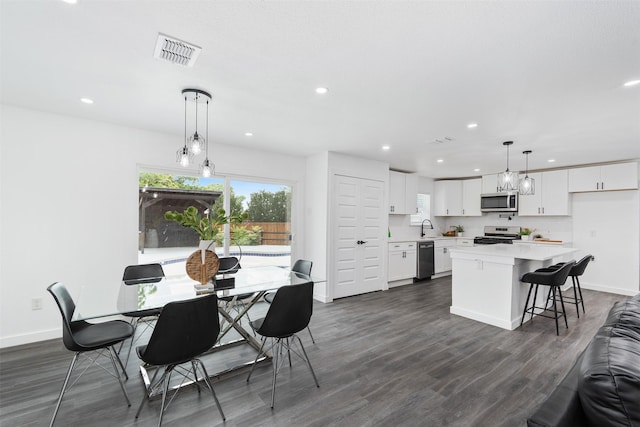 214 Betty Dr, Richardson, TX 75081 - dining room featuring baseboards, recessed lighting, and dark wood-style flooring