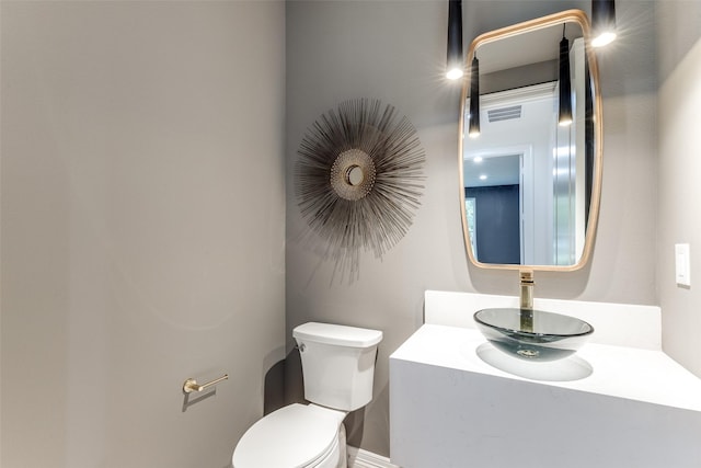 11207 Dwarfs Cir, Dallas, TX 75229 - half bathroom featuring toilet and vanity