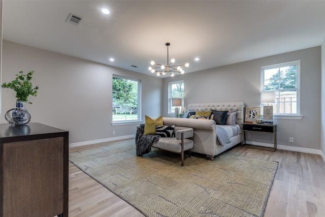 11207 Dwarfs Cir, Dallas, TX 75229 - bedroom featuring multiple windows, light wood-style floors, a chandelier, and recessed lighting