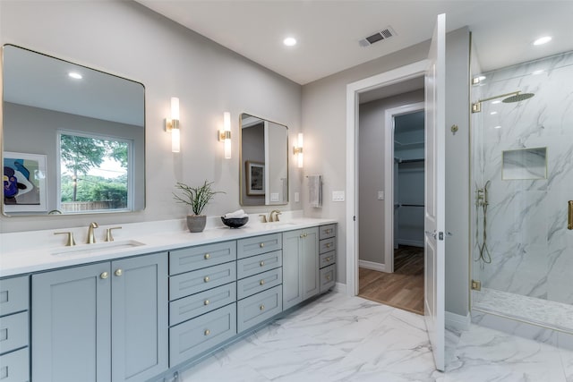 11207 Dwarfs Cir, Dallas, TX 75229 - full bath featuring a marble finish shower, double vanity, marble finish floors, recessed lighting, and a walk in closet