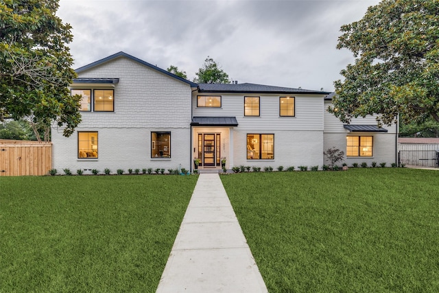 11207 Dwarfs Cir, Dallas, TX 75229 - view of front of home featuring brick siding and a standing seam roof
