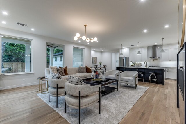 11207 Dwarfs Cir, Dallas, TX 75229 - living area with light wood-style floors, a chandelier, and recessed lighting