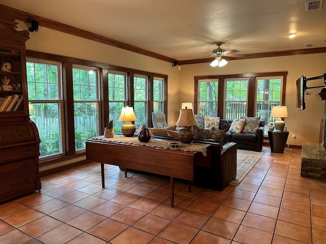 17889 County Road 134, Flint, TX 75762 - living room with light tile patterned floors, ceiling fan, and ornamental molding