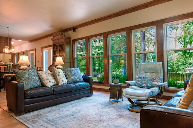 17889 County Road 134, Flint, TX 75762 - living room with light tile patterned floors, plenty of natural light, ornamental molding, and a chandelier