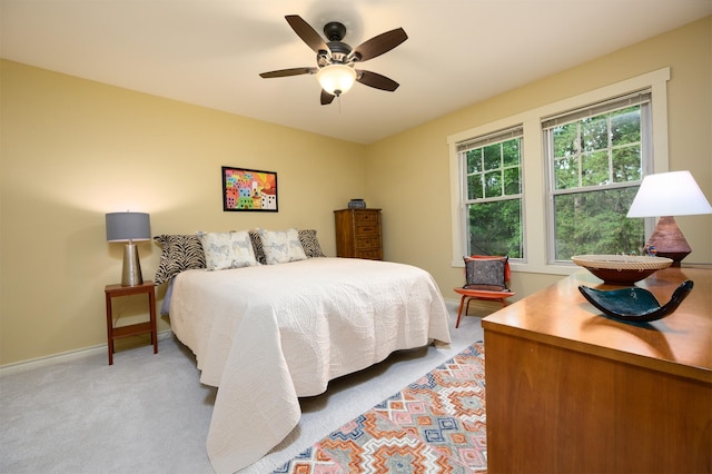 17889 County Road 134, Flint, TX 75762 - bedroom featuring light carpet, baseboards, and a ceiling fan