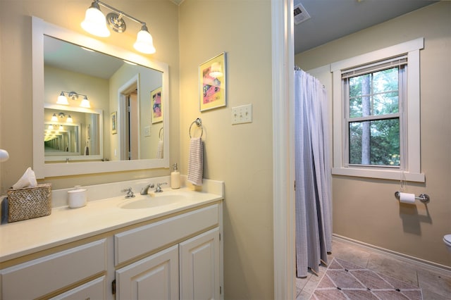 17889 County Road 134, Flint, TX 75762 - full bath featuring vanity, toilet, tile patterned flooring, baseboards, and a shower with curtain
