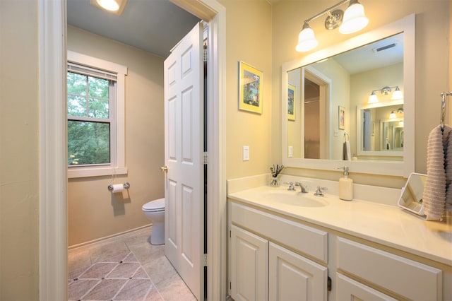 17889 County Road 134, Flint, TX 75762 - bathroom featuring toilet, vanity, baseboards, and tile patterned floors