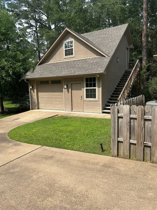 17889 County Road 134, Flint, TX 75762 - view of front of home with roof with shingles, a garage, stairs, and concrete driveway