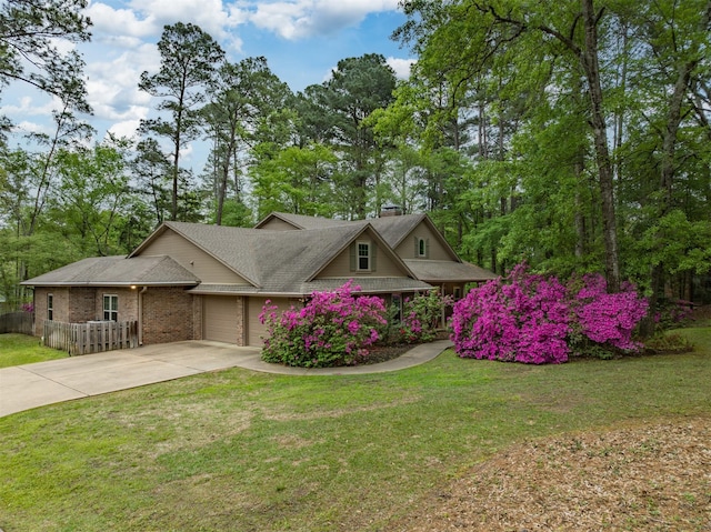17889 County Road 134, Flint, TX 75762 - view of front facade with driveway, a garage, brick siding, a chimney, and roof with shingles