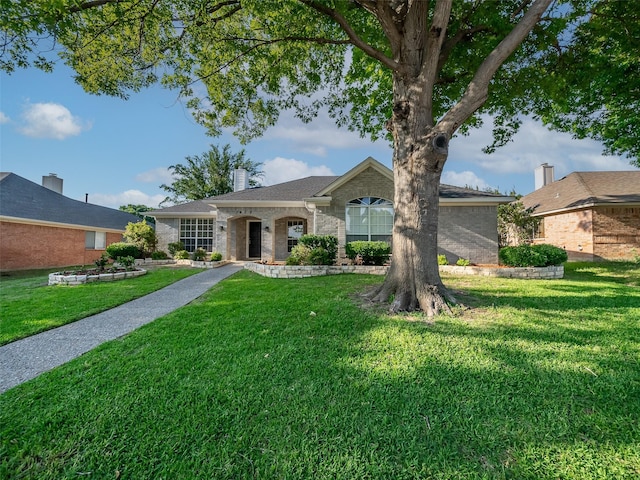 1409 Rivercrest Blvd, Allen, TX 75002 - single story home featuring a front lawn, brick siding, and a chimney